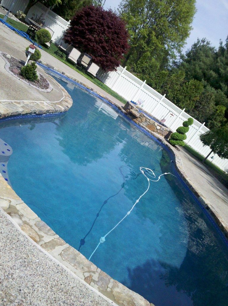 Pool deck pressure washing removing algae and grime in Wellington FL